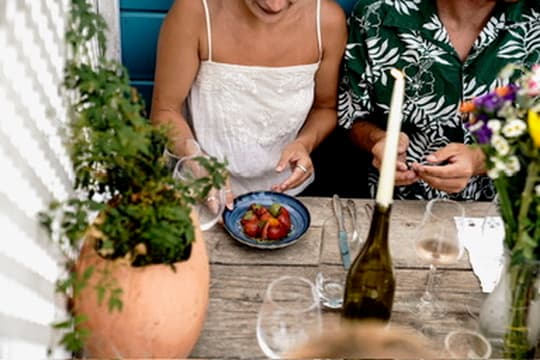 Guests sharing a plated course at a long table